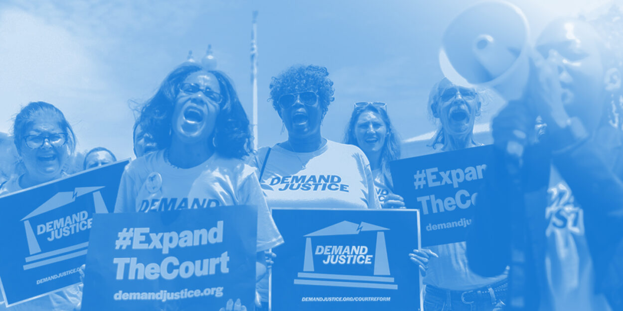 Demand Justice supporters with posters